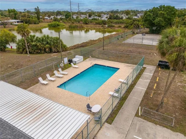 Community pool featuring a patio and a water view
