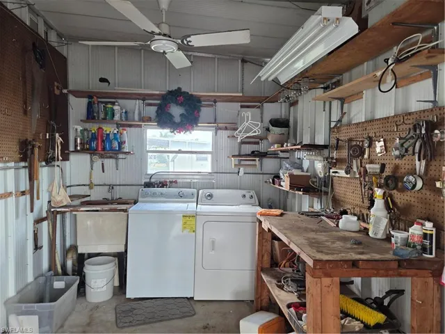 Washer, dryer & laundry tub located in the spacious shed
