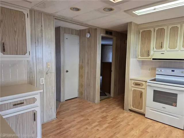 Kitchen with view to 1 of 3 Bedrooms.