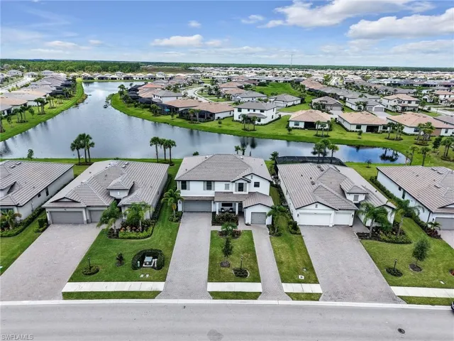 Aerial view of residential area with a large body of water