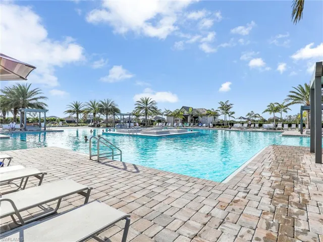 Community pool featuring a patio