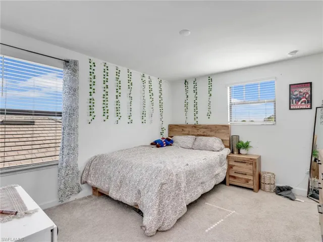 Bedroom featuring carpet