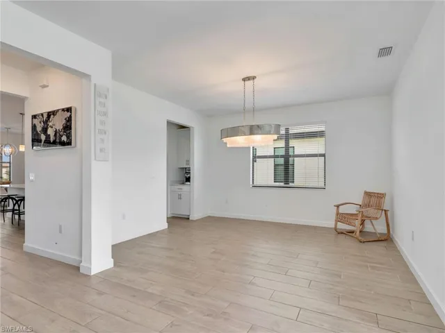 Unfurnished dining area featuring light wood-style flooring