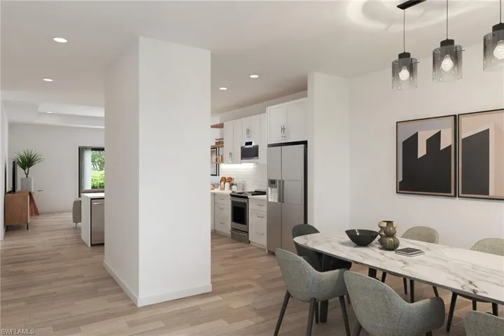 Dining area with light hardwood / wood-style floors