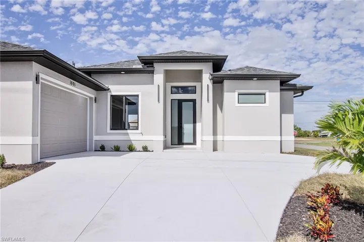 View of front of home featuring a garage