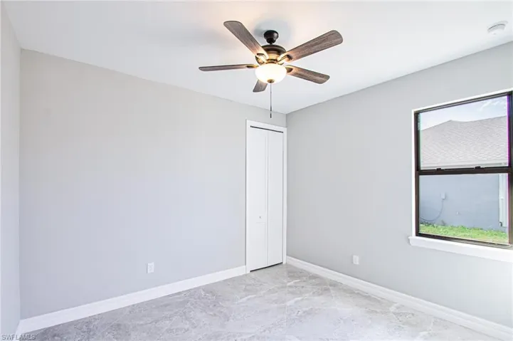 Unfurnished room with ceiling fan