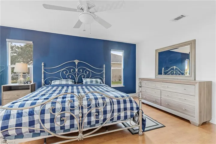 Bedroom featuring hardwood / wood-style floors and ceiling fan