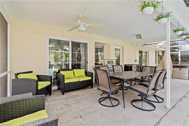 Sunroom featuring ceiling fan