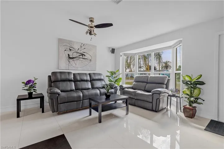 Tiled living room with ceiling fan