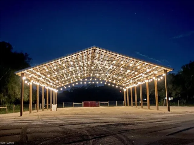 View of pole barn at night.