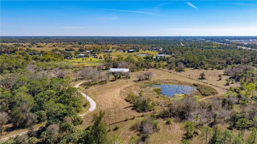 Aerial view featuring a rural view and a water view