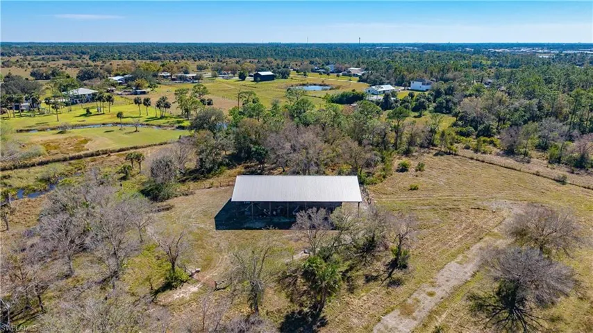 Birds eye view of property with a rural view
