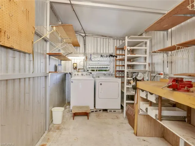 Below grade area with washing machine and clothes dryer