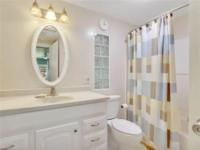 Bathroom with vanity and shower / bath combo