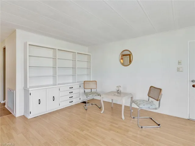 Living area with light wood-type flooring