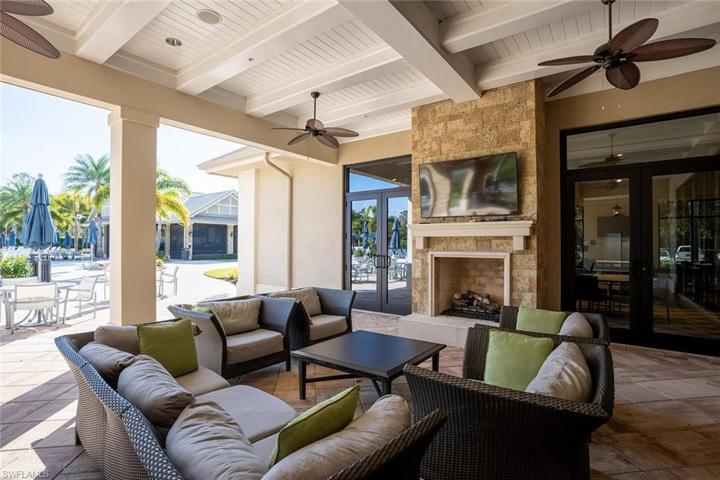 Outdoor fireplace and seating at pool