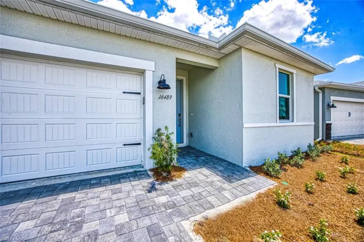 View of exterior entry featuring a garage