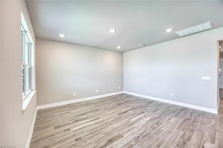Spare room with light wood-type flooring