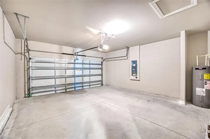 Garage with a garage door opener and water heater