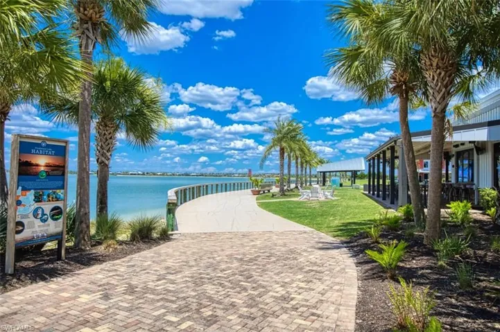 Surrounding BR community with a yard and a water view