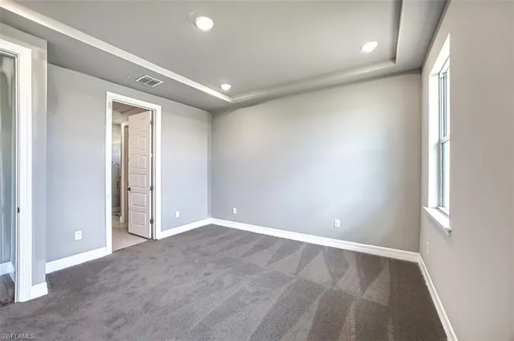 Unfurnished room featuring carpet flooring