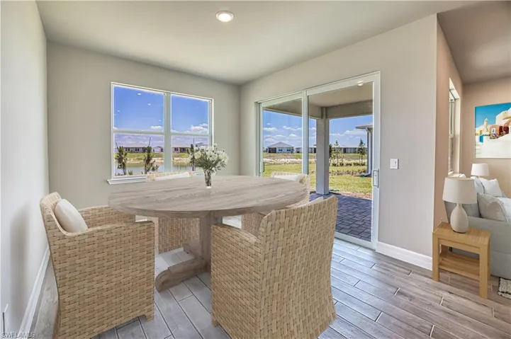 Virtual Stage Dining space with wood-type flooring