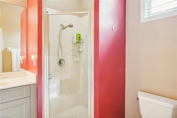 Primary Bathroom with walk in shower, separate tub and dual sinks