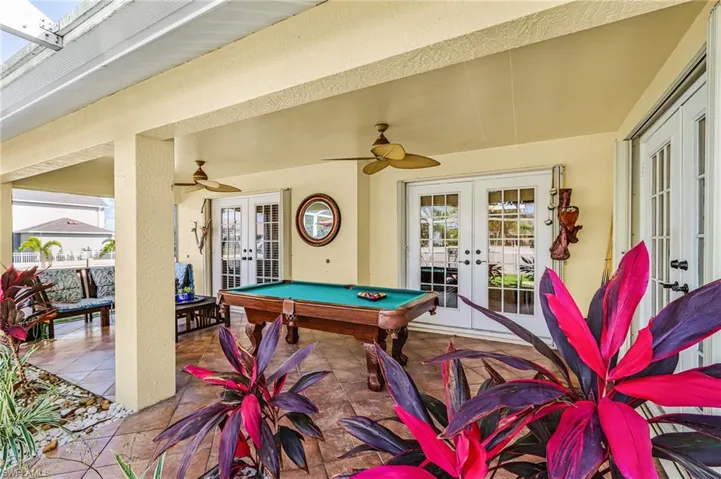 View of patio / terrace featuring french doors and ceiling fan