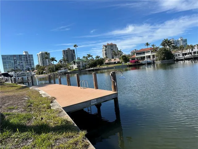 Dock area featuring a water view