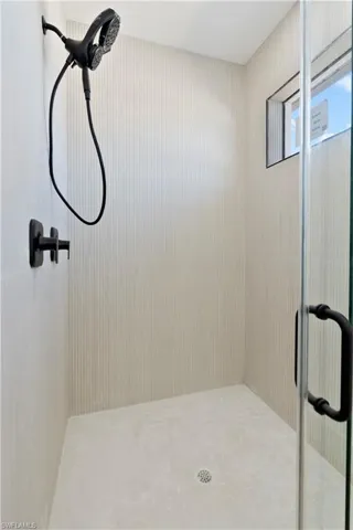 Full bathroom with a shower stall