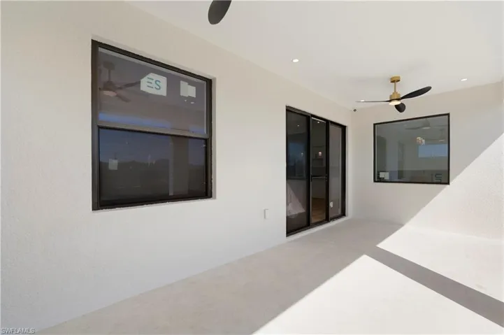 View of patio featuring a ceiling fan
