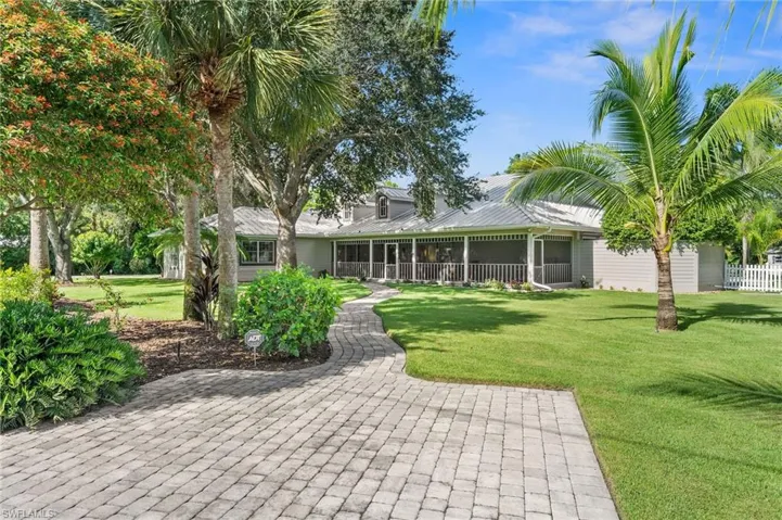 Front of property with pavered walkway to front porch