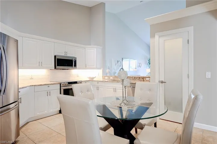 Kitchen updated with granite and beautiful wave back splash