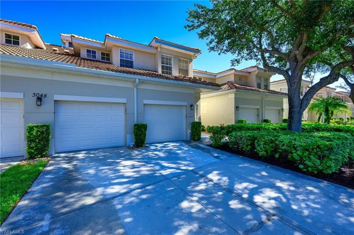 Mediterranean / spanish home with stucco siding and concrete driveway