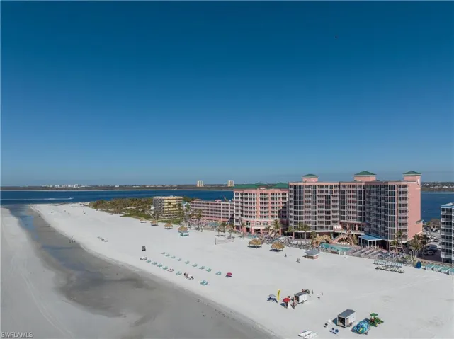 Drone / aerial view with a beach view and a water view