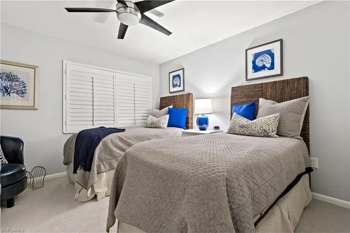Bedroom with carpet and ceiling fan