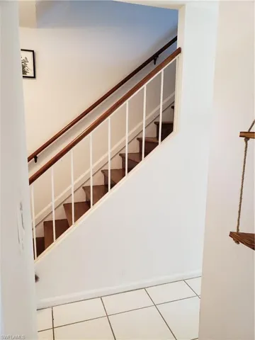 Looking out from kitchen to stairway going up