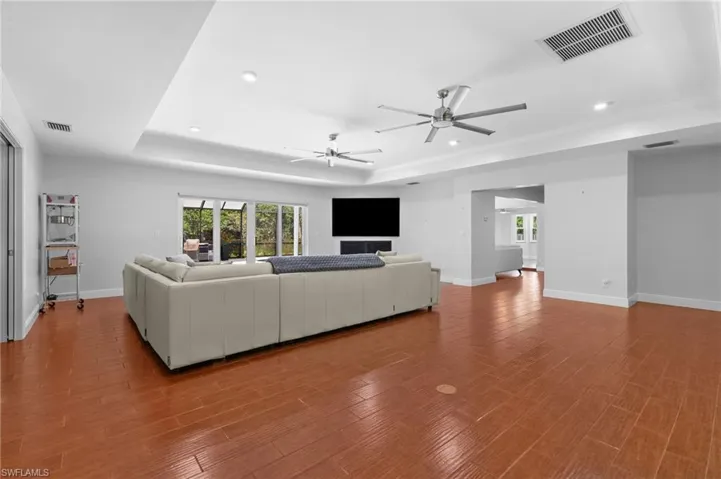 Large living room with tray ceiling