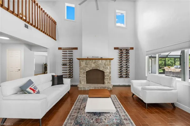 Living room with fire place and loft