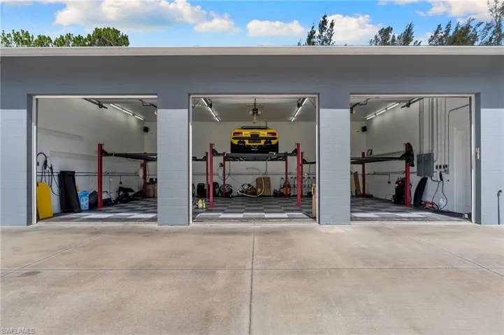 three newly installed high-capacity, industrial aluminum vehicle lifts to effortlessly house 6 cars.