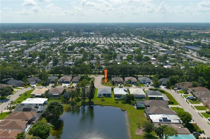 Aerial perspective showcasing a residential area with varied home styles and mature landscaping