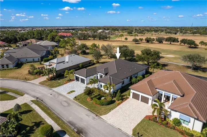Aerial view of residential area with a golf club