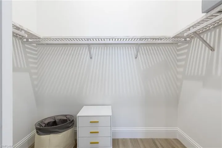 Walk in closet featuring light wood finished floors