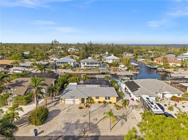 Aerial view of residential area with a large body of water