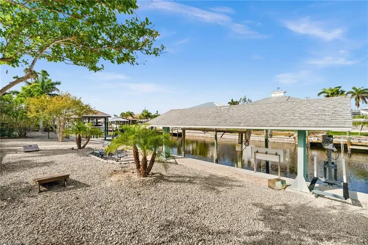 Dock featuring a water view and boat lift