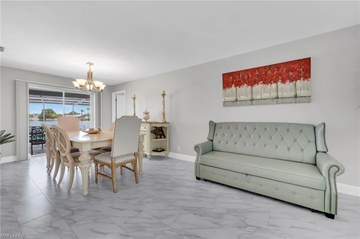 Spacious interior with large format tile flooring and light gray wall color