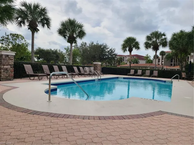 Community pool featuring a patio area