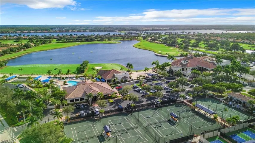View of property location featuring a golf club and a large body of water