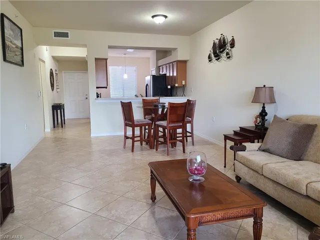 Living area with light tile patterned floors