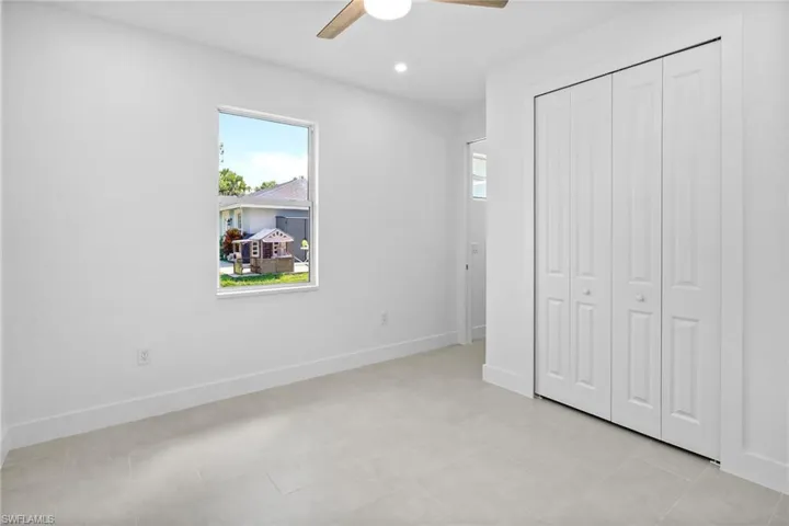 Unfurnished bedroom featuring a ceiling fan, a closet, and recessed lighting